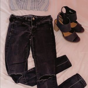 AE black low rise jeans holey knees